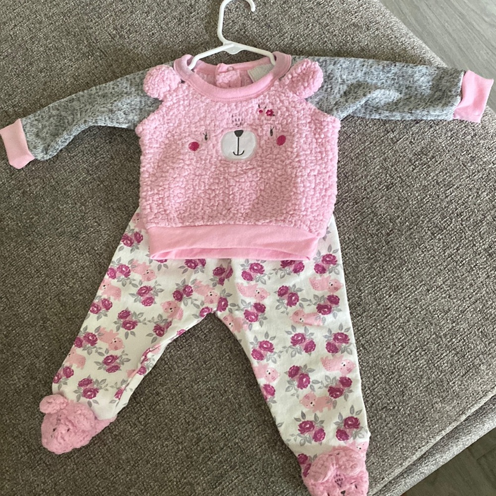 Pink sweater with sweatpants feet in